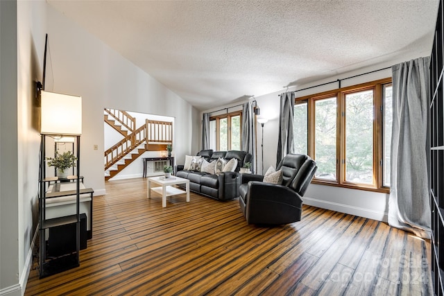 living room featuring plenty of natural light and dark hardwood / wood-style floors