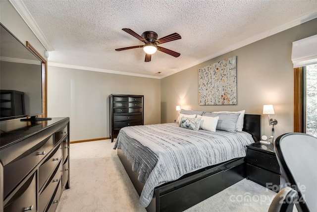 bedroom featuring ceiling fan, light colored carpet, a textured ceiling, and ornamental molding