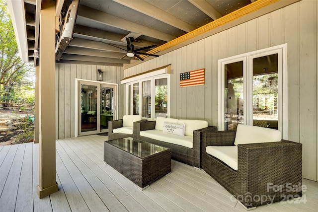 wooden terrace featuring outdoor lounge area and french doors