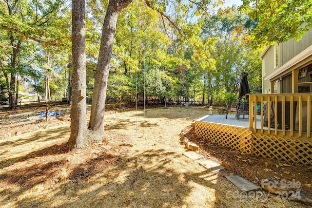 view of yard featuring a wooden deck