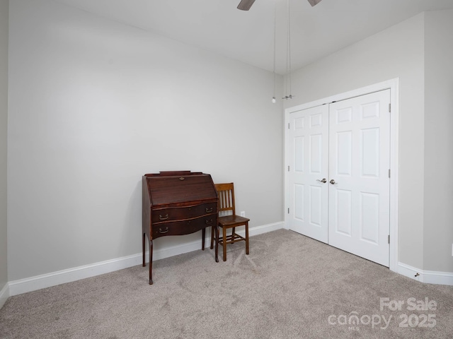 miscellaneous room featuring light colored carpet and ceiling fan