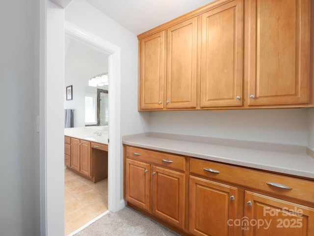 kitchen with light tile patterned floors