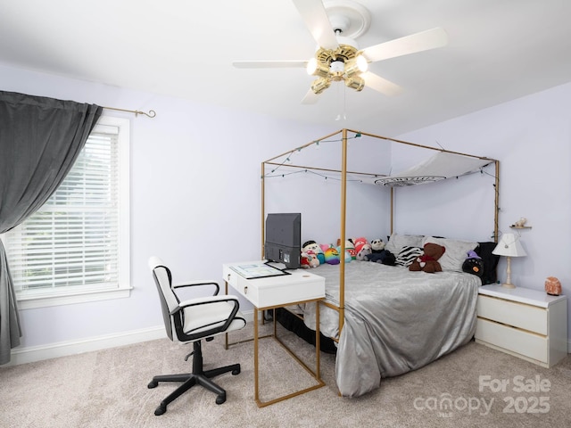 bedroom featuring ceiling fan and light colored carpet