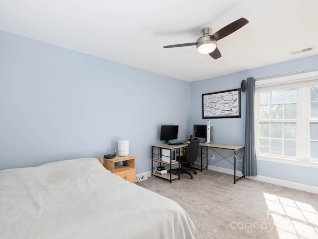 bedroom with light carpet and ceiling fan