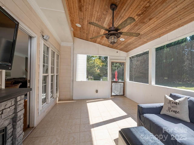 sunroom featuring ceiling fan, lofted ceiling, and wood ceiling