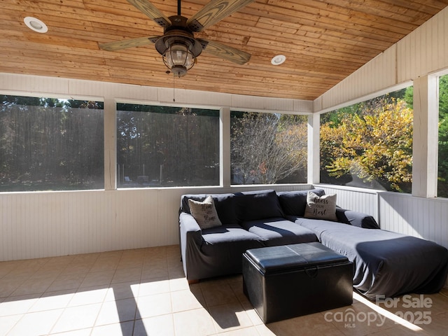 sunroom / solarium with lofted ceiling, wood ceiling, and ceiling fan