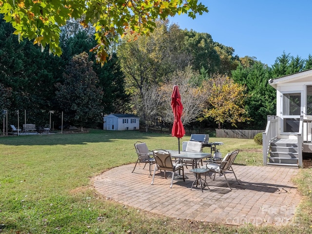 view of patio / terrace featuring a storage unit