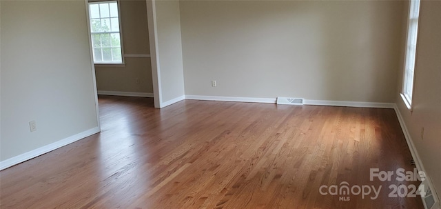 spare room featuring hardwood / wood-style floors