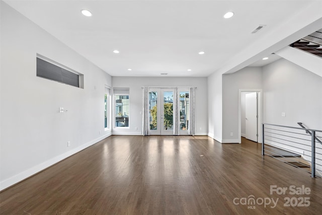 unfurnished living room with dark hardwood / wood-style floors