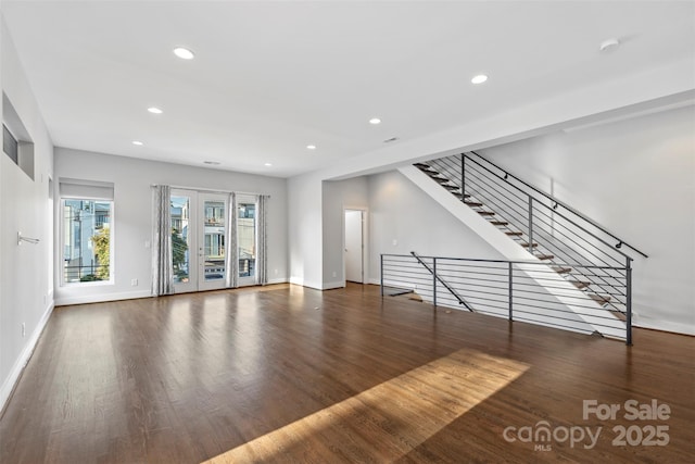 unfurnished living room with dark hardwood / wood-style floors