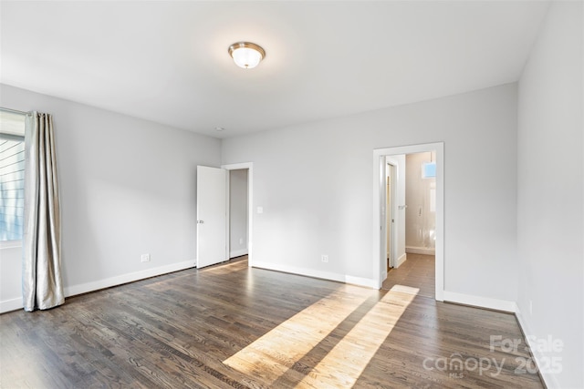 empty room featuring dark hardwood / wood-style floors