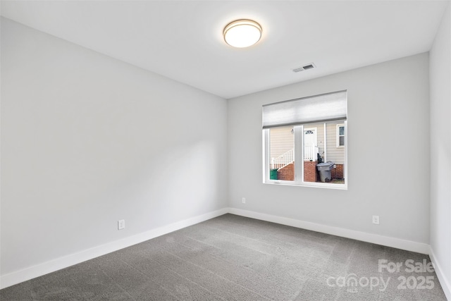 spare room featuring carpet floors