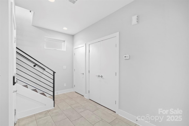 foyer entrance featuring light tile patterned floors