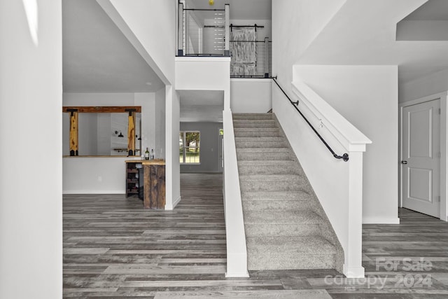 stairs featuring wood-type flooring