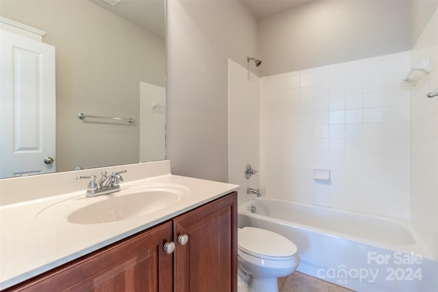 full bathroom featuring tile patterned flooring, vanity, toilet, and tiled shower / bath combo