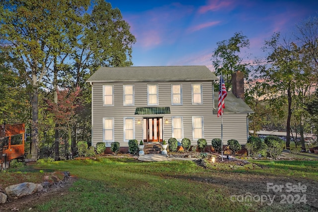 colonial house with a lawn