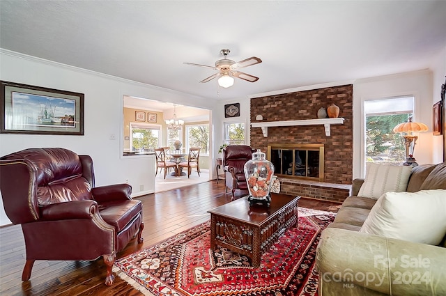 living room featuring ornamental molding, a wealth of natural light, and wood-type flooring