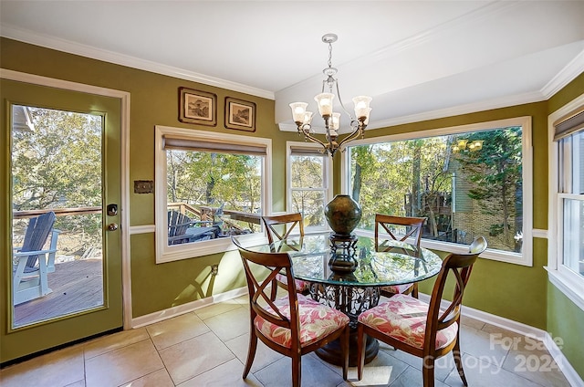 tiled dining room featuring a chandelier and ornamental molding