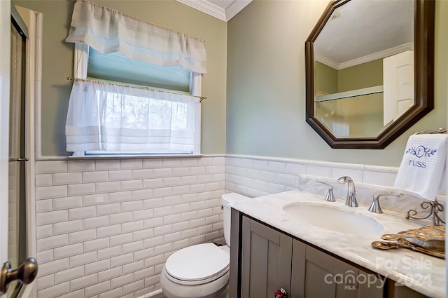 bathroom with toilet, vanity, tile walls, and crown molding