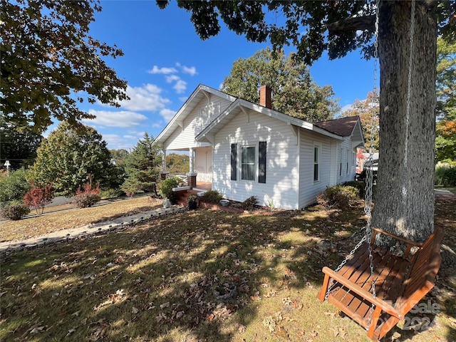 view of home's exterior with a yard