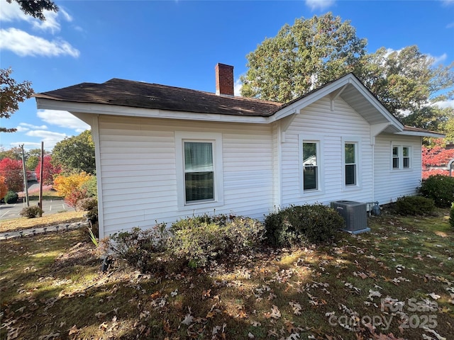 back of house featuring central AC unit