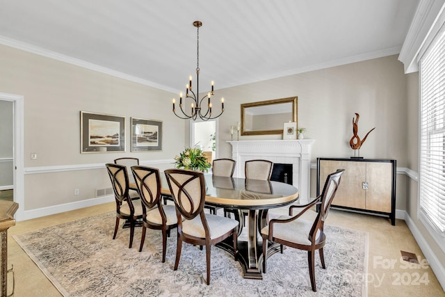 carpeted dining area featuring ornamental molding and an inviting chandelier