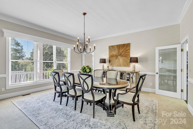 dining area with light colored carpet, crown molding, and an inviting chandelier