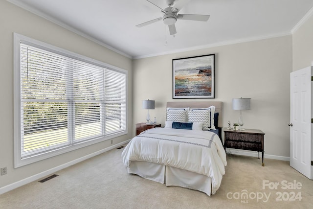 bedroom featuring light colored carpet, multiple windows, ornamental molding, and ceiling fan