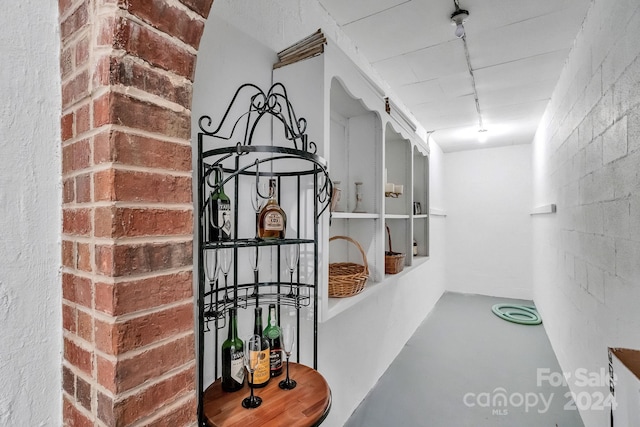 hallway with concrete flooring