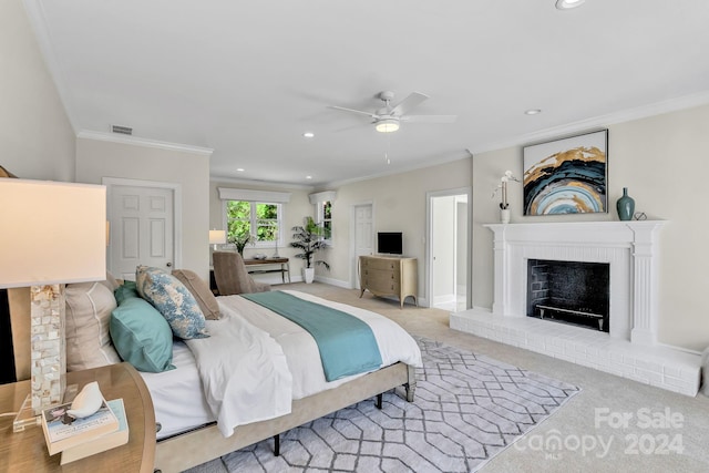 carpeted bedroom with a brick fireplace, ceiling fan, and ornamental molding