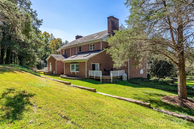 4141 Shattalon Dr, Winston Salem, NC 27106 - back of property with a chimney, brick siding, a wooden deck, and a yard