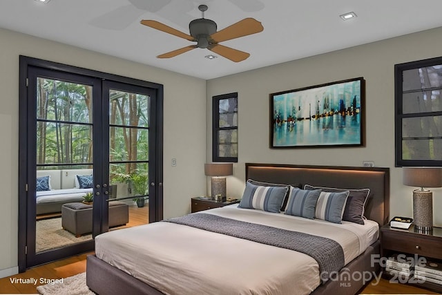 bedroom with french doors, access to outside, ceiling fan, and light hardwood / wood-style floors