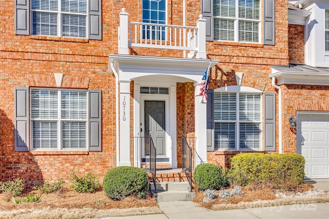 property entrance featuring brick siding