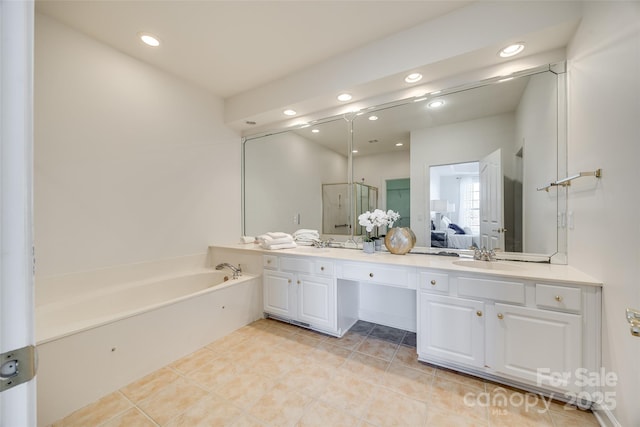 full bath with recessed lighting, a sink, a bath, double vanity, and ensuite bath