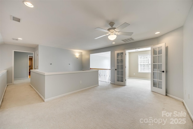 unfurnished room with recessed lighting, visible vents, baseboards, and french doors