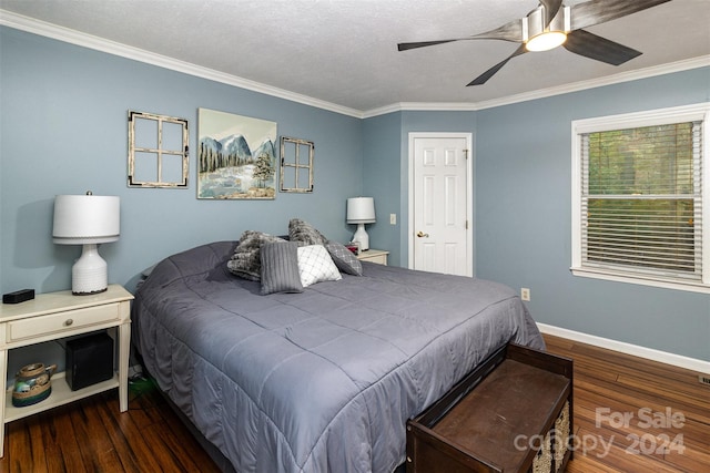 bedroom featuring ornamental molding, a textured ceiling, ceiling fan, and dark hardwood / wood-style floors