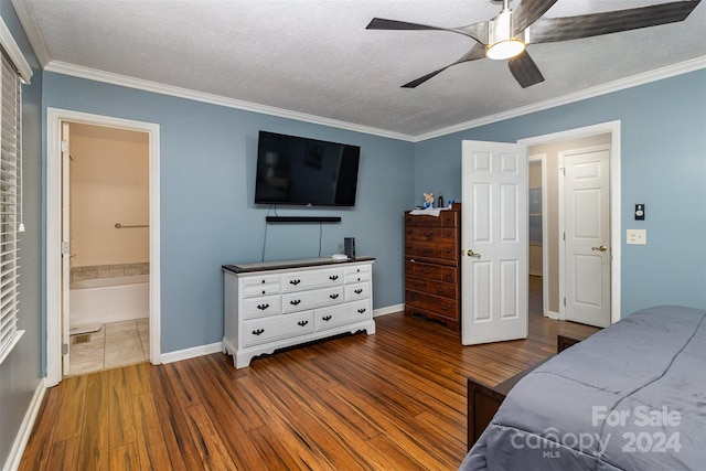 bedroom featuring ornamental molding, a textured ceiling, hardwood / wood-style flooring, and ceiling fan