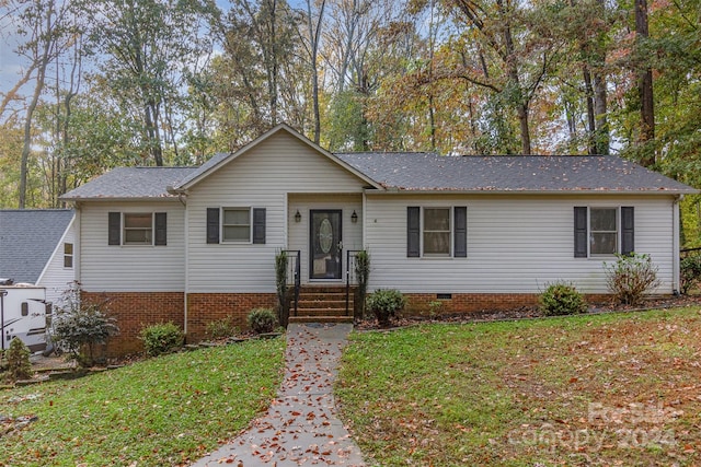 ranch-style home with a front lawn