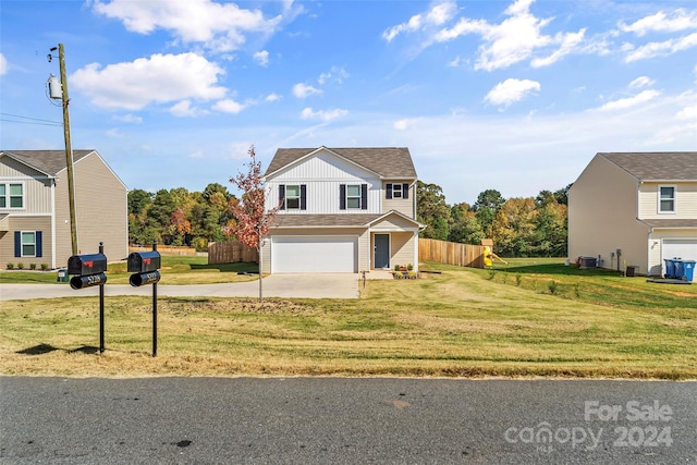 front facade with central AC, a garage, and a front lawn