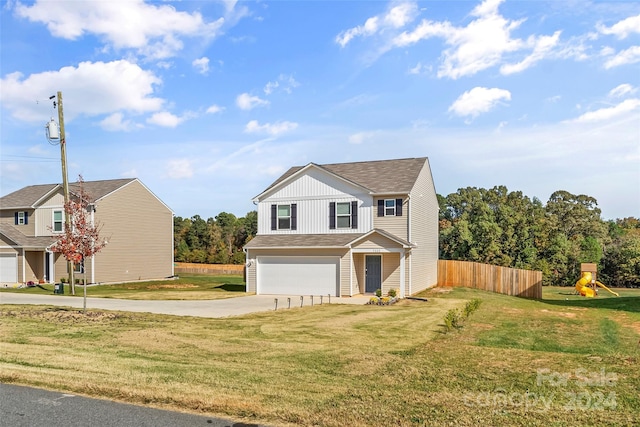 view of front of home with a garage and a front yard