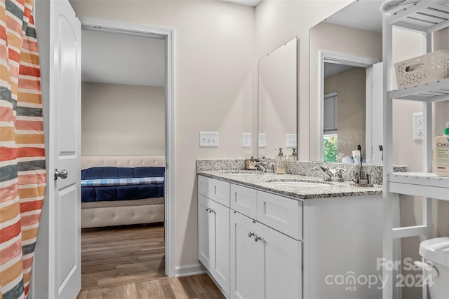 bathroom featuring vanity and hardwood / wood-style flooring