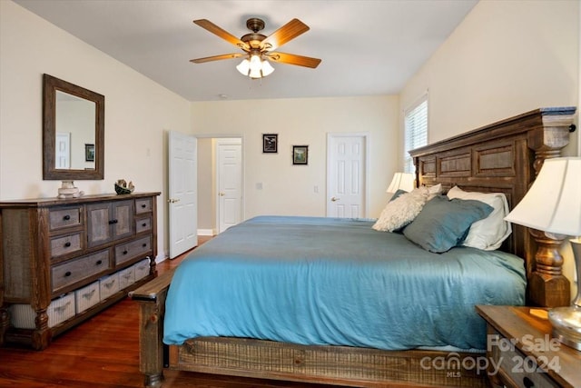 bedroom featuring ceiling fan and dark hardwood / wood-style floors