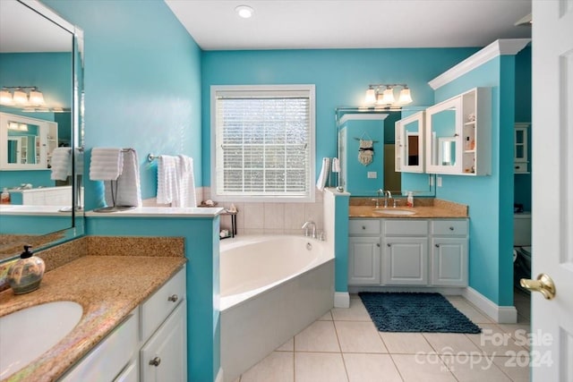 bathroom featuring vanity, a tub to relax in, and tile patterned floors