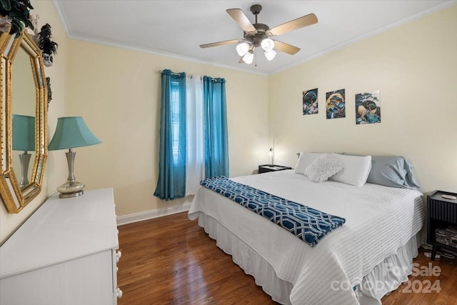 bedroom with ceiling fan, crown molding, and dark wood-type flooring