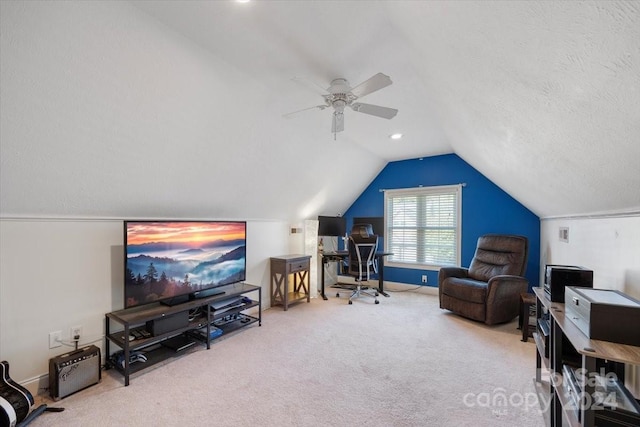 interior space with carpet, ceiling fan, lofted ceiling, and a textured ceiling