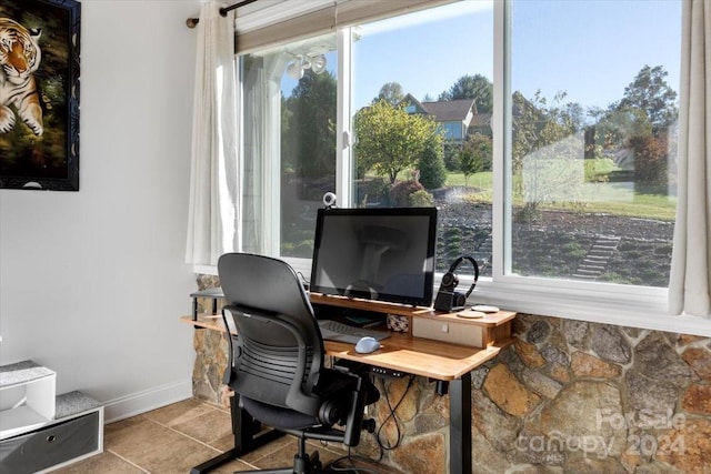 office area featuring a healthy amount of sunlight and light tile patterned flooring