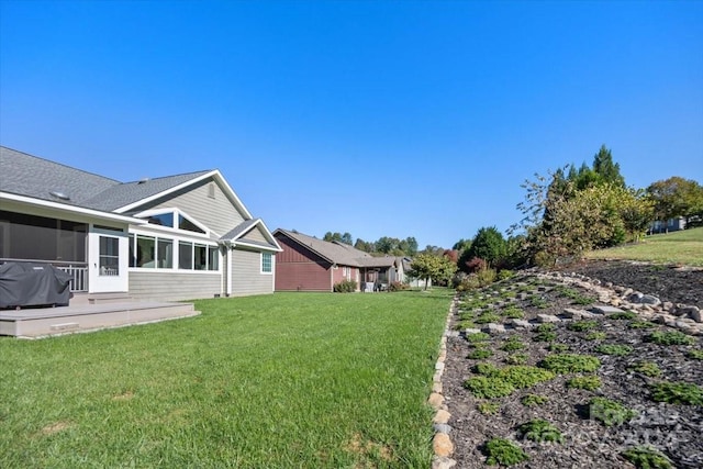 view of yard featuring a sunroom