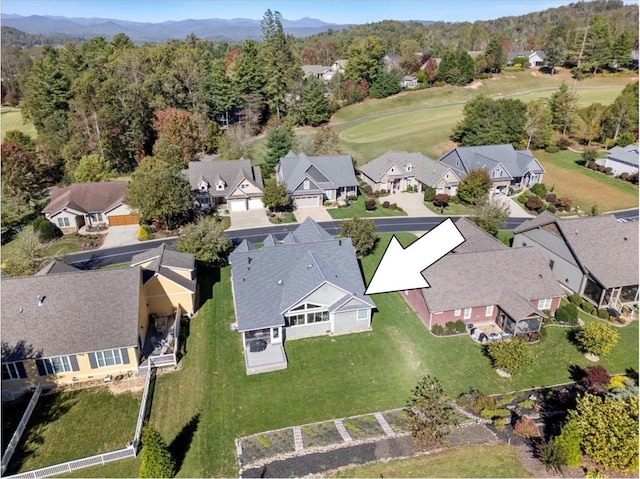 birds eye view of property featuring a mountain view