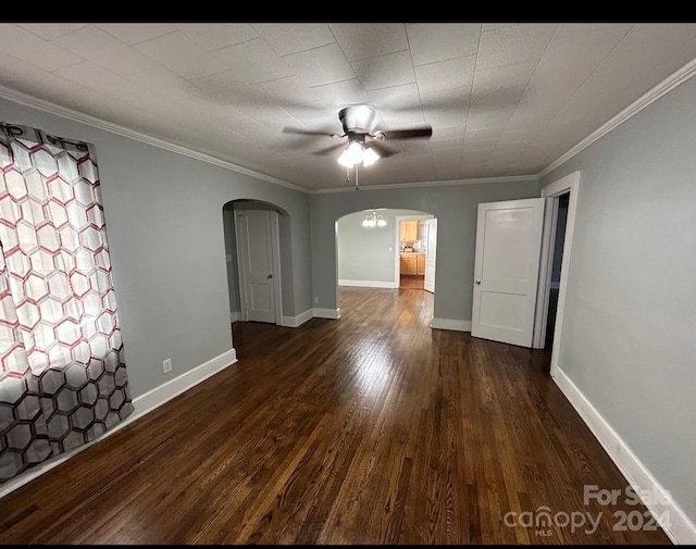 unfurnished room featuring crown molding, dark hardwood / wood-style floors, and ceiling fan