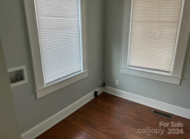 empty room featuring dark hardwood / wood-style floors